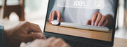 job search concept, man browsing work opportunities online using job search computer app. find your career, man looking at online website by laptop computer.